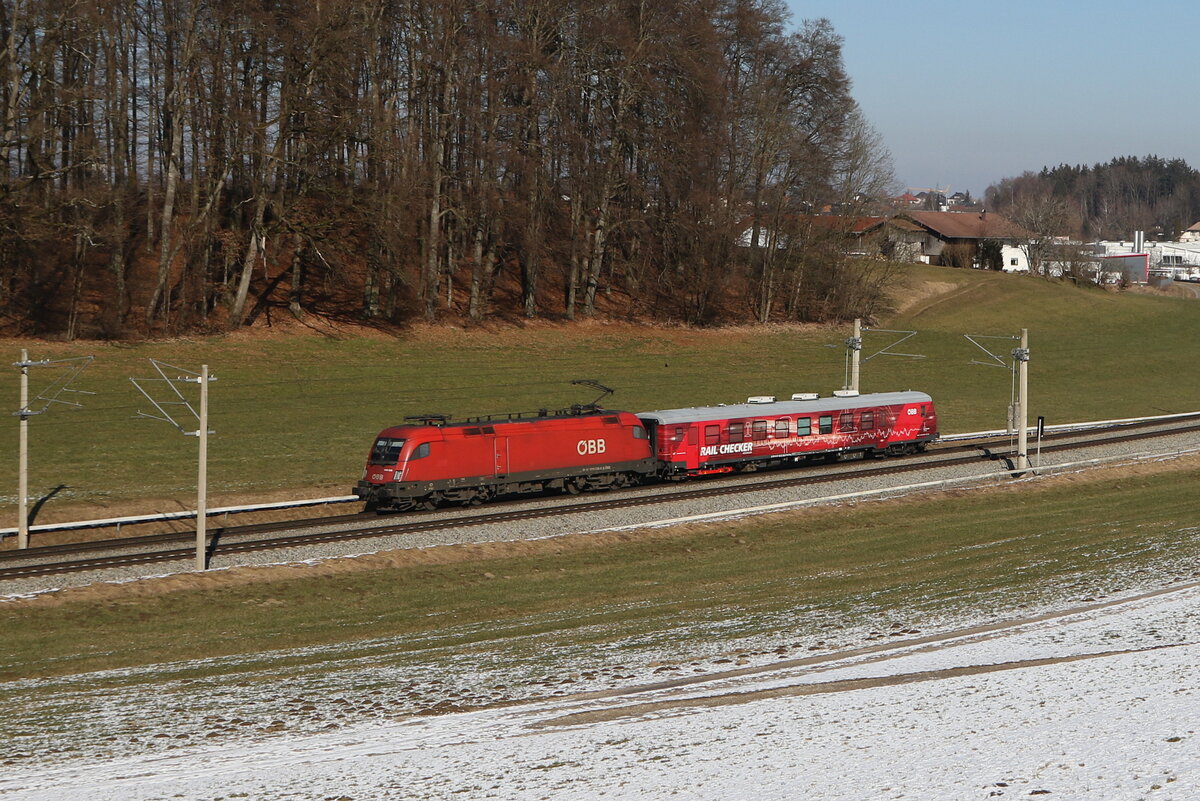 1016 035 war bei Axdorf am 19. Februar 2025 mit dem  Rail Checker  in Richtung Kufstein unterwegs.