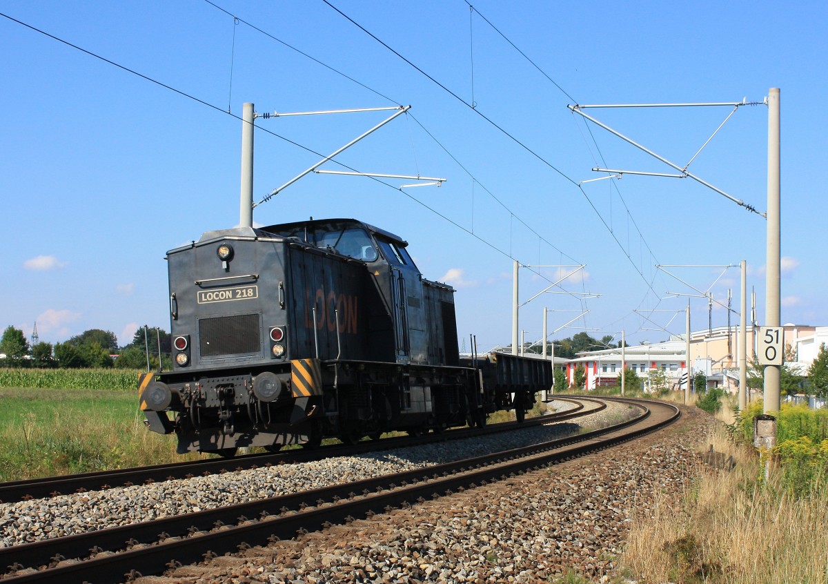 203 124-3 von  LOCON  war am 30.08.2013 als  LOCON 218  mit einem Flachwagen
bei Traunstein in Richtung Rosenheim unterwegs. 